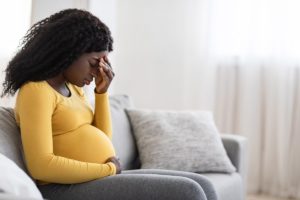 a pregnant woman struggling with addiction knows she must detox for the sake of her unborn baby but has concerns