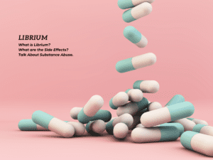 Prescription pills are poured on a pink background.